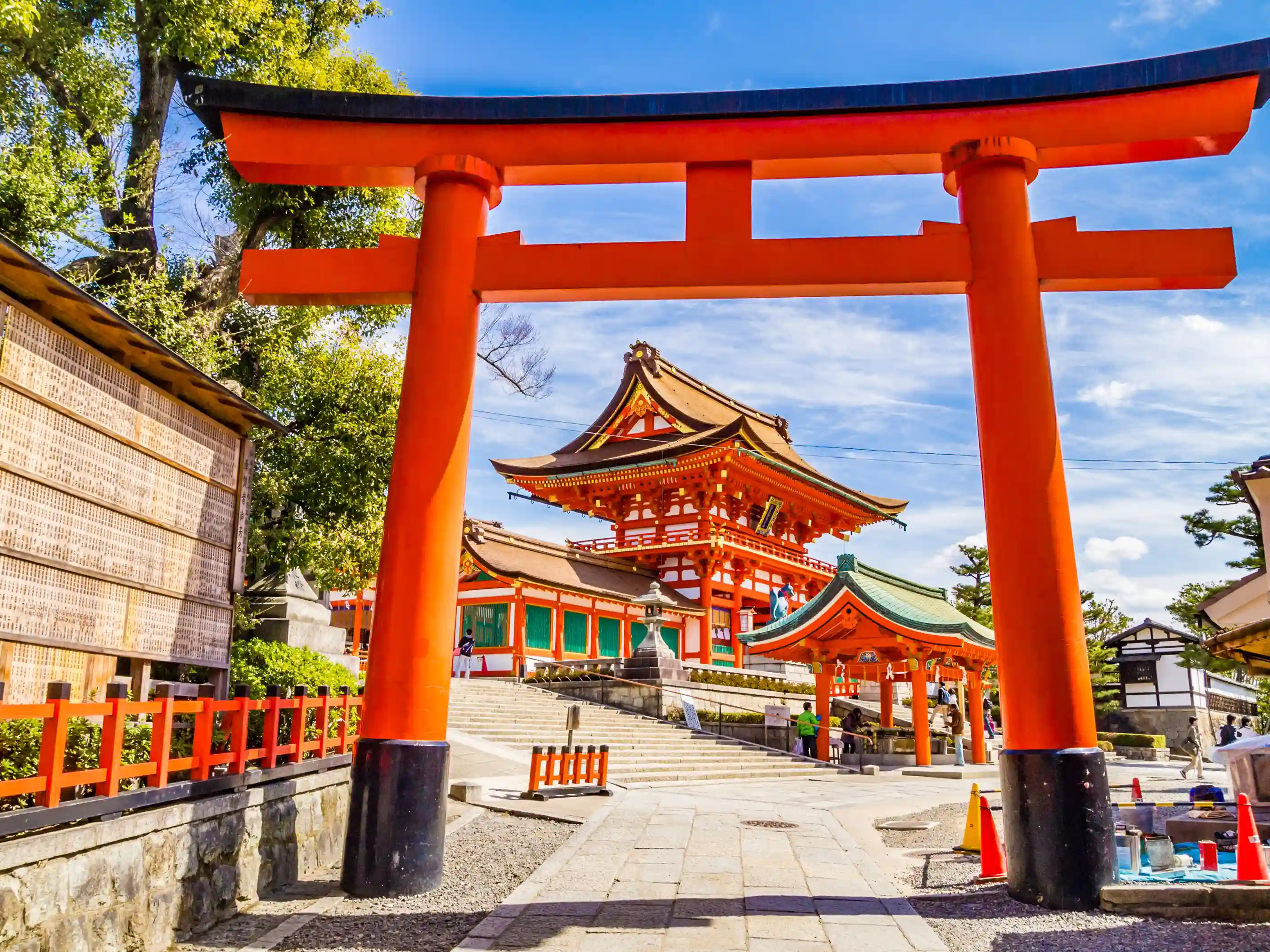 Nara park with free roaming deer and historic temple in background