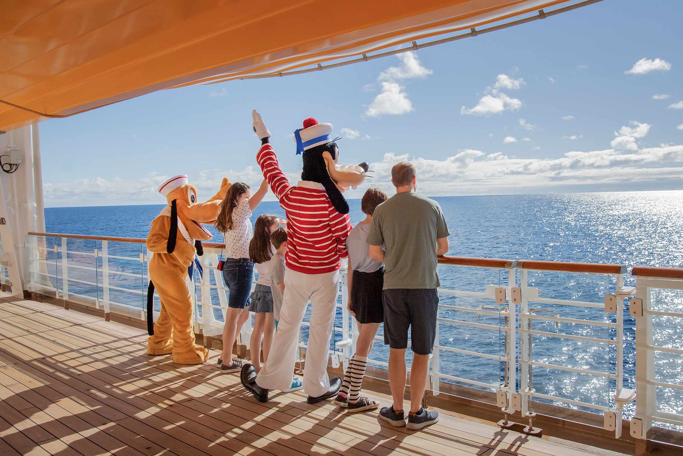 Spacious Disney Cruise stateroom with split bathroom family layout