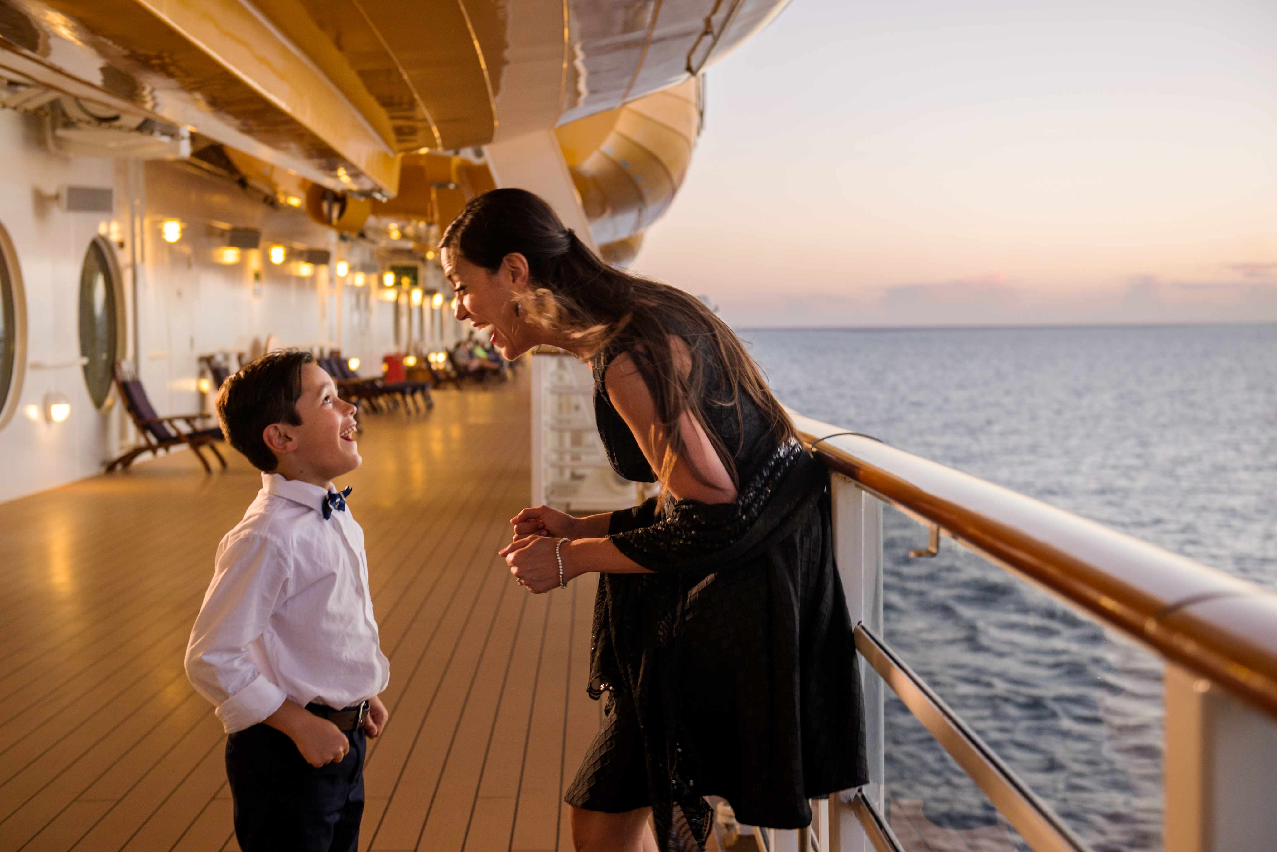 Disney Cruise stateroom balcony overlooking the ocean at sunset