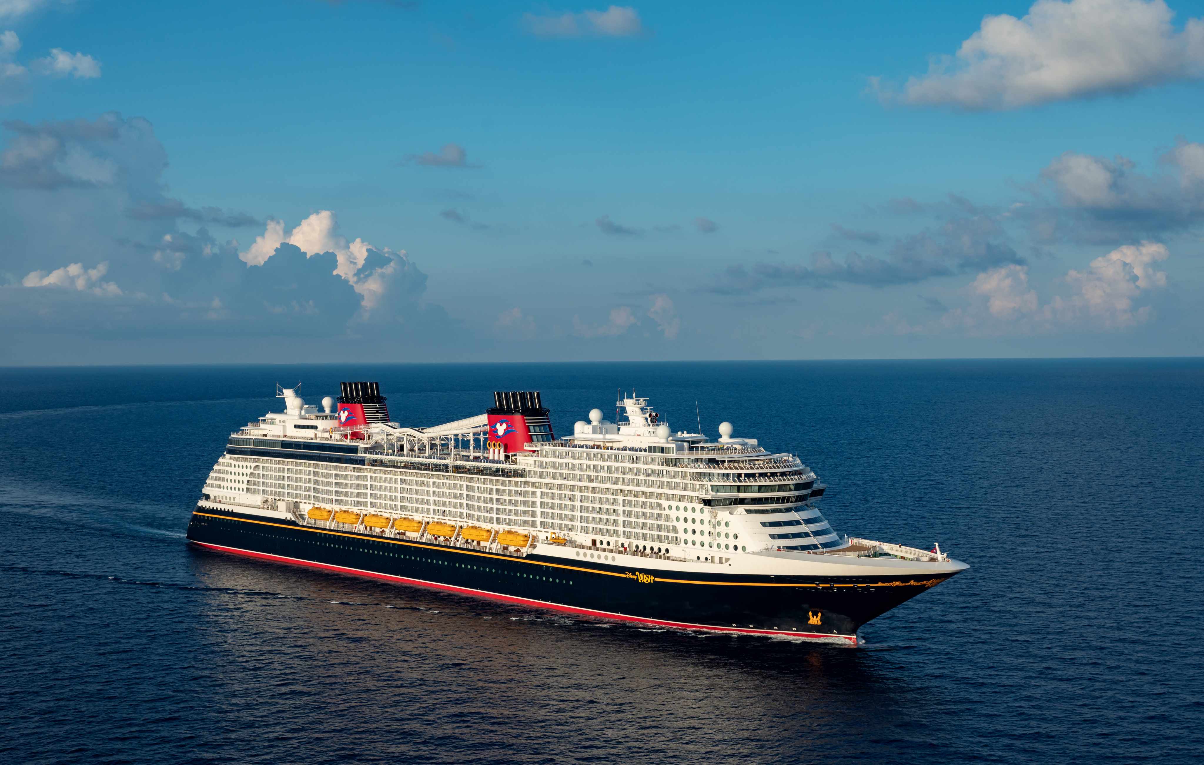 Disney Wish cruise ship sailing through the Caribbean with families onboard
