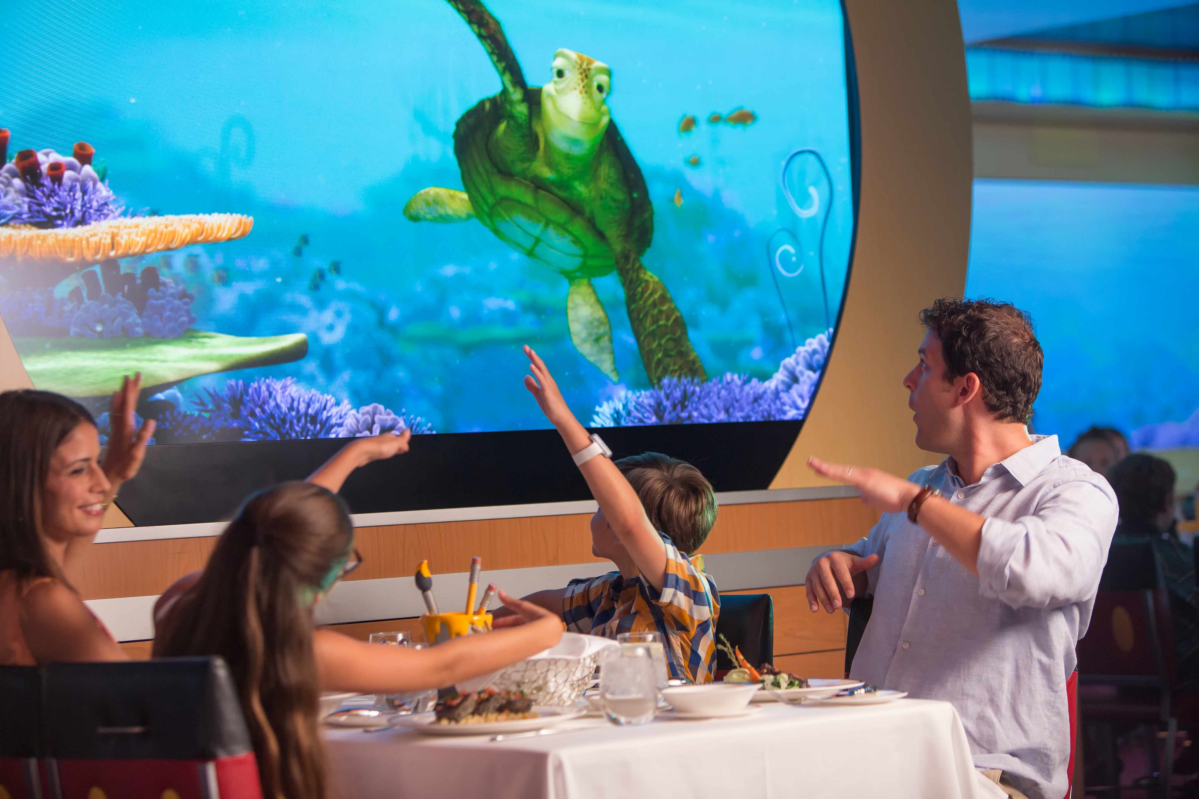 Family enjoying onboard Disney entertainment