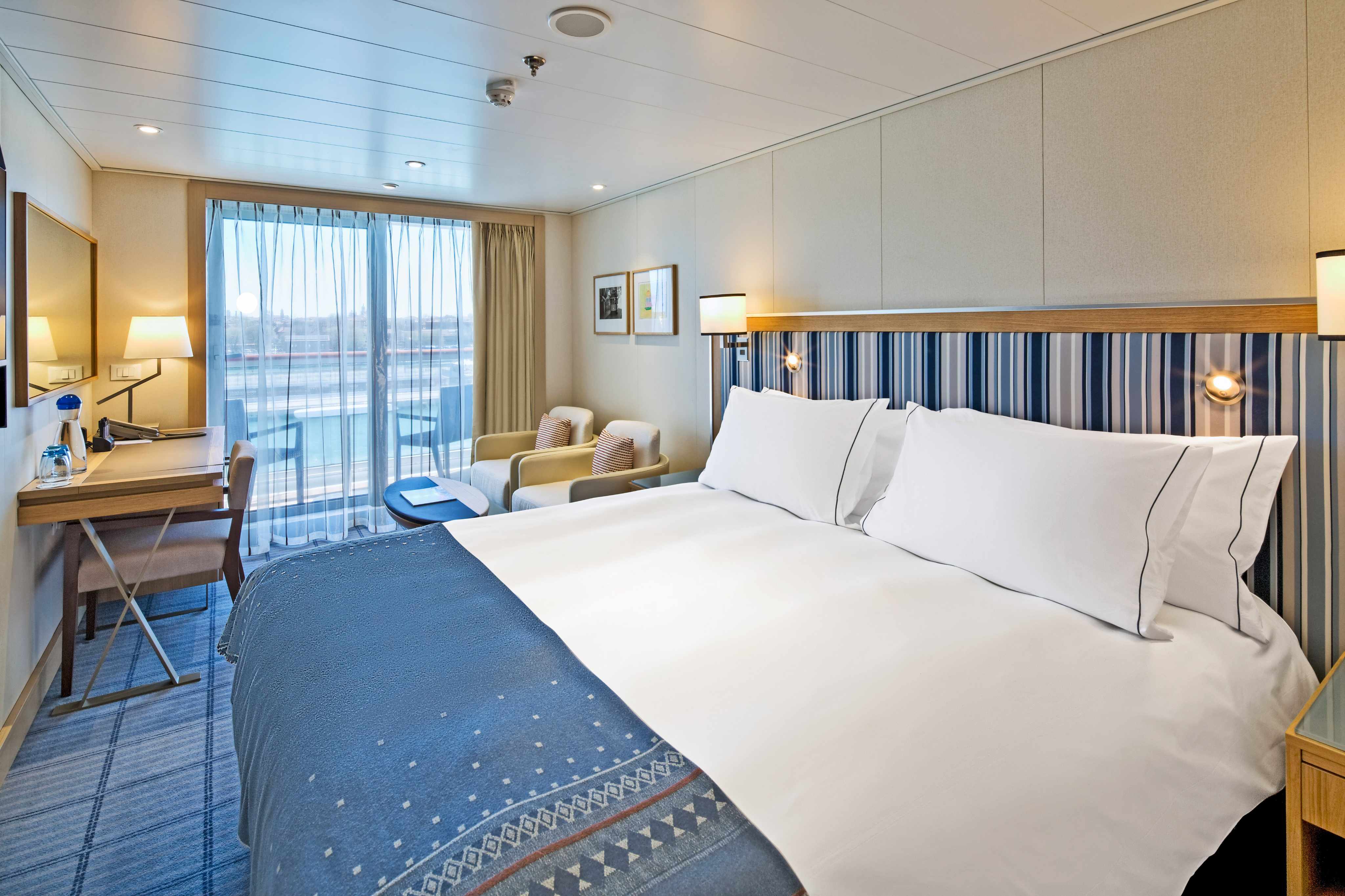Viking cruise couple relaxing on deck with ocean views