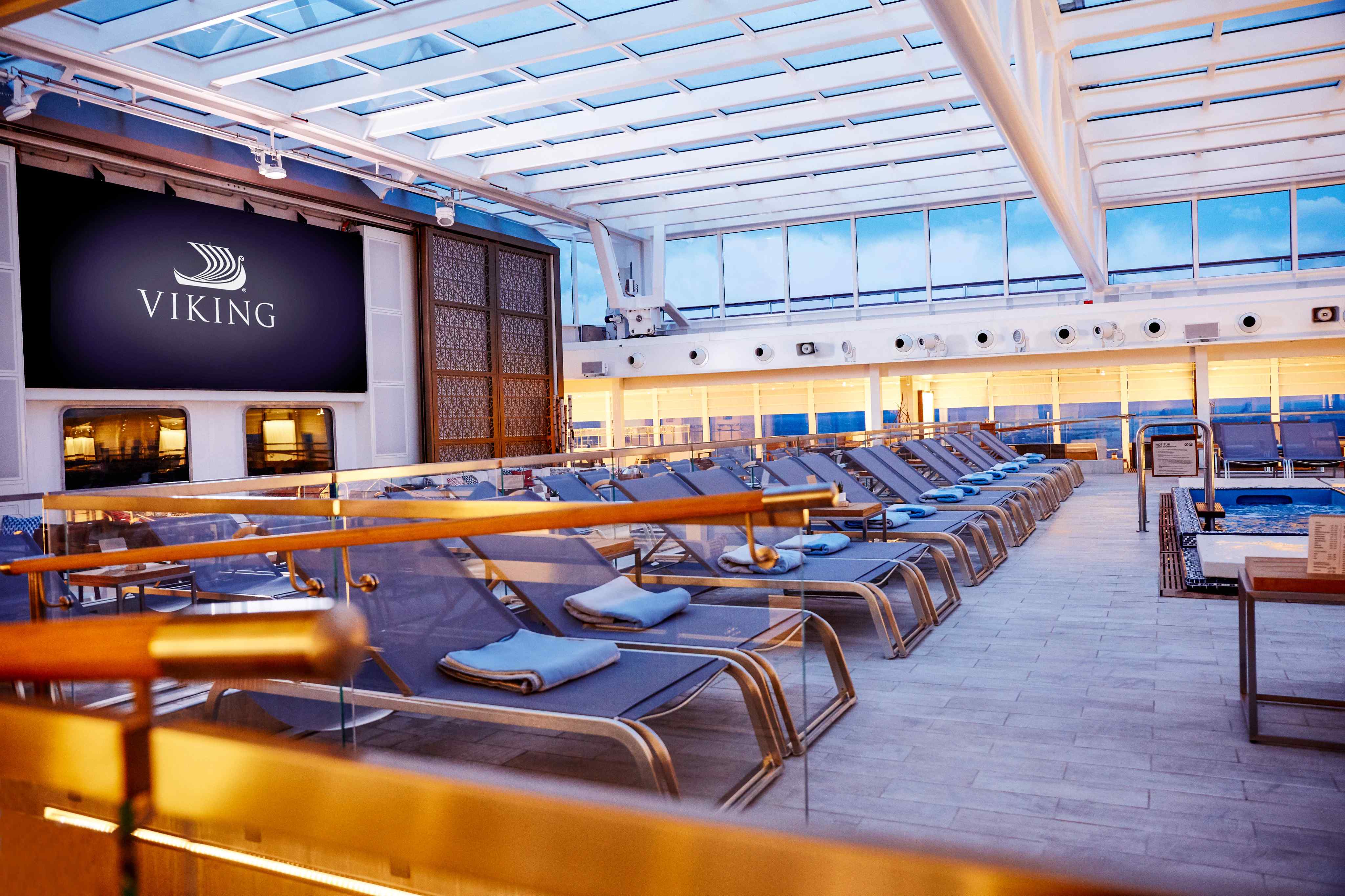 Main pool deck with loungers on a Viking cruise ship