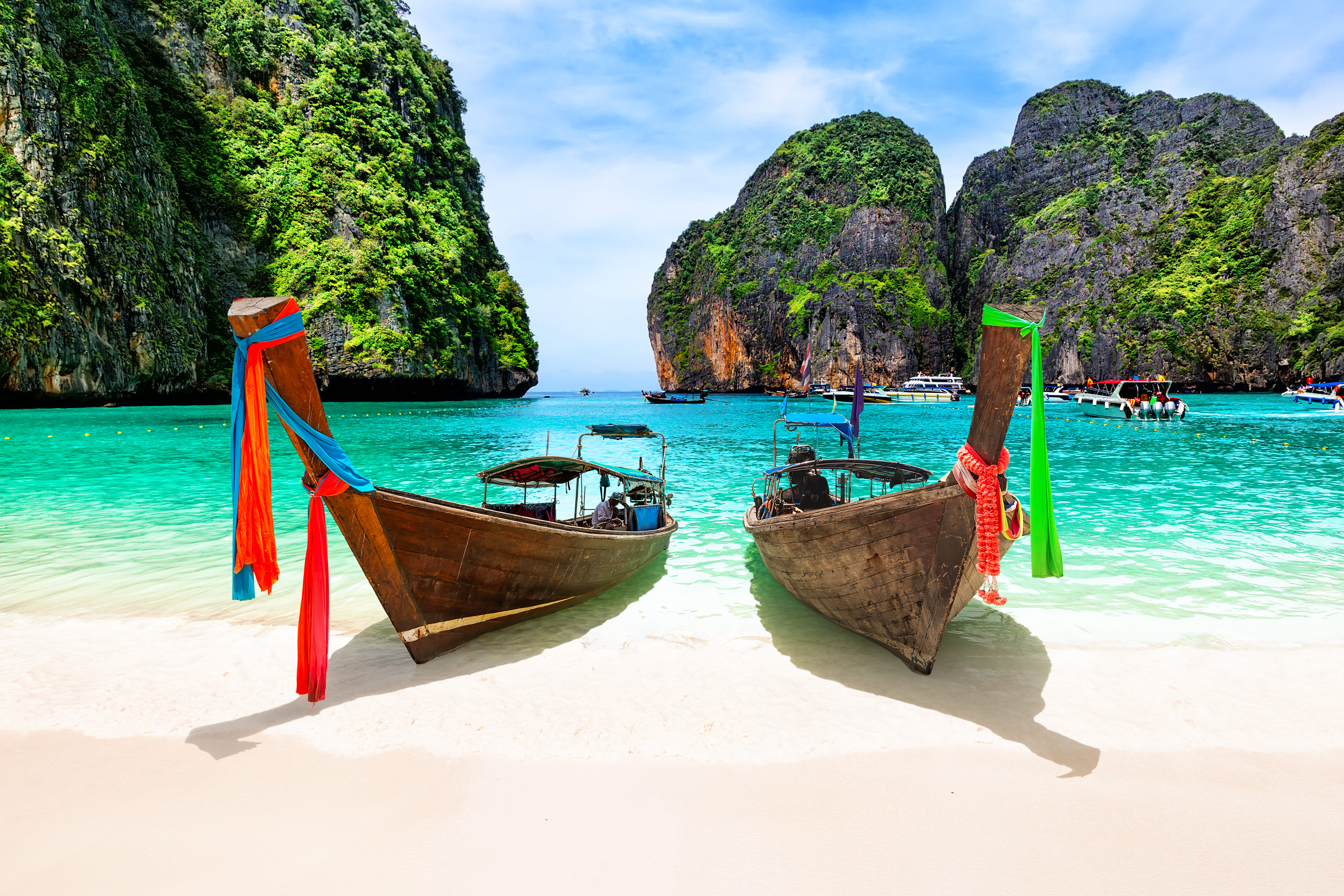 Private excursion boats sailing on calm blue waters during customized shore excursion