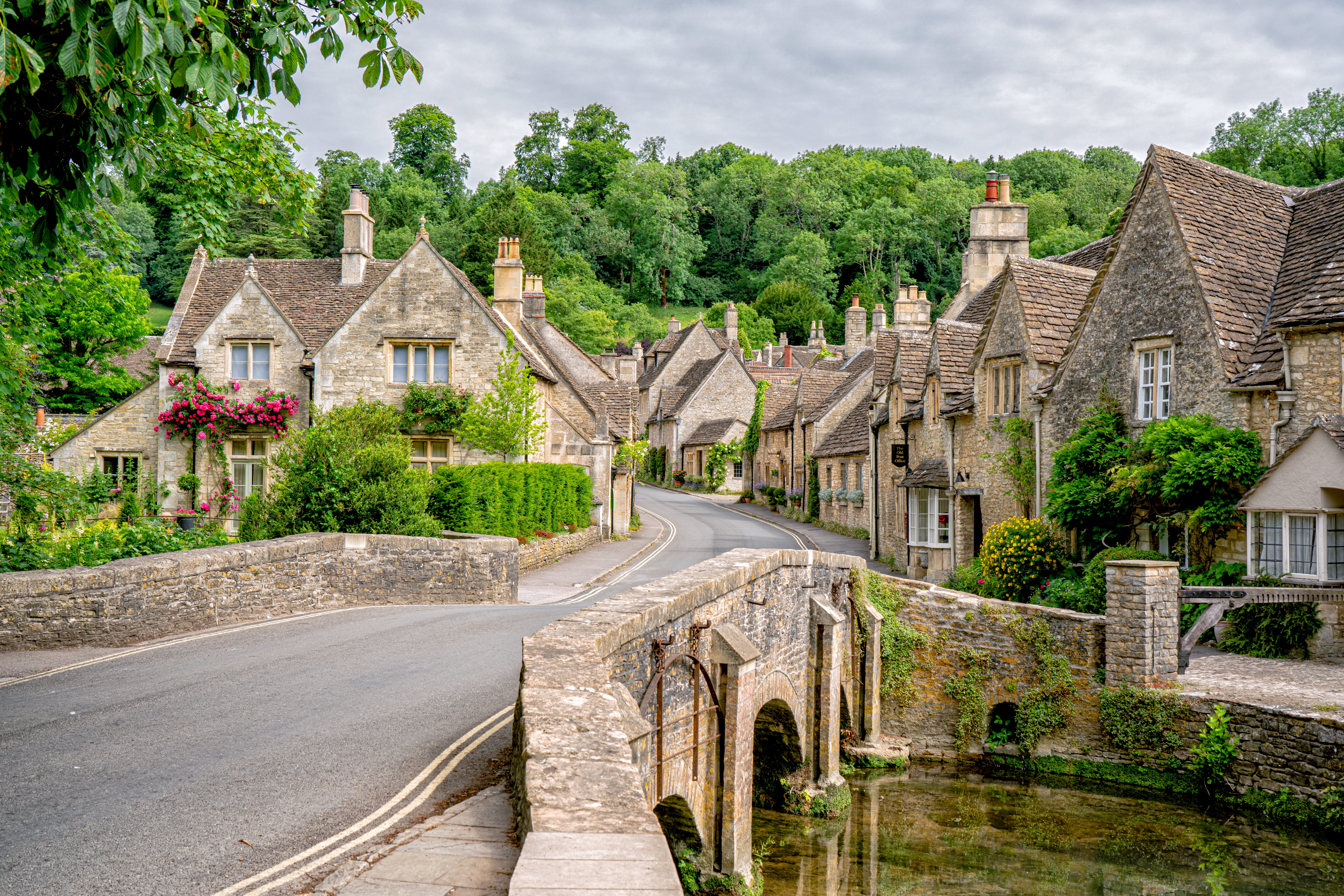 Picturesque Castle Combe village with traditional stone cottages in England's Cotswolds