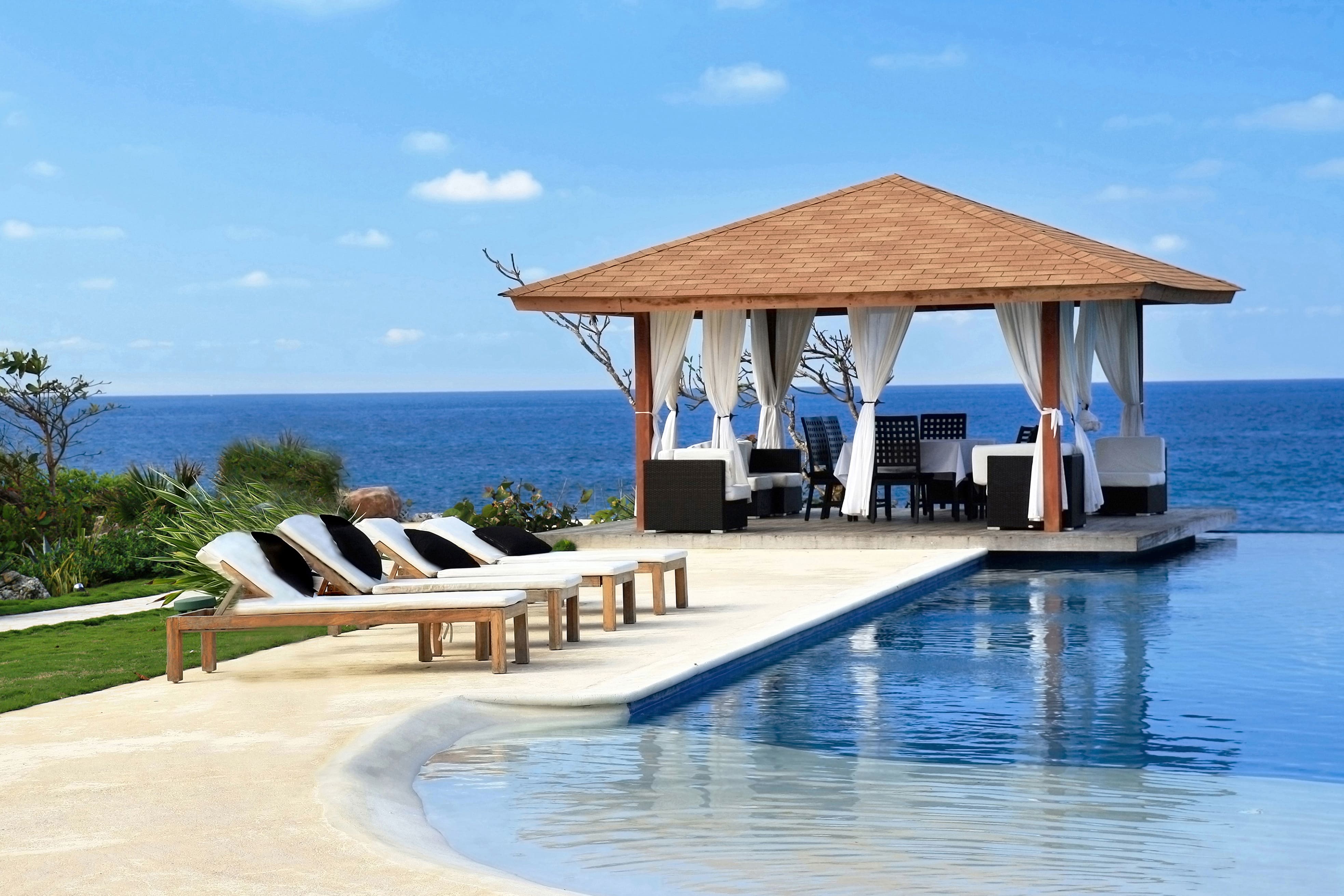 Stunning infinity pool at luxury villa retreat with ocean views
