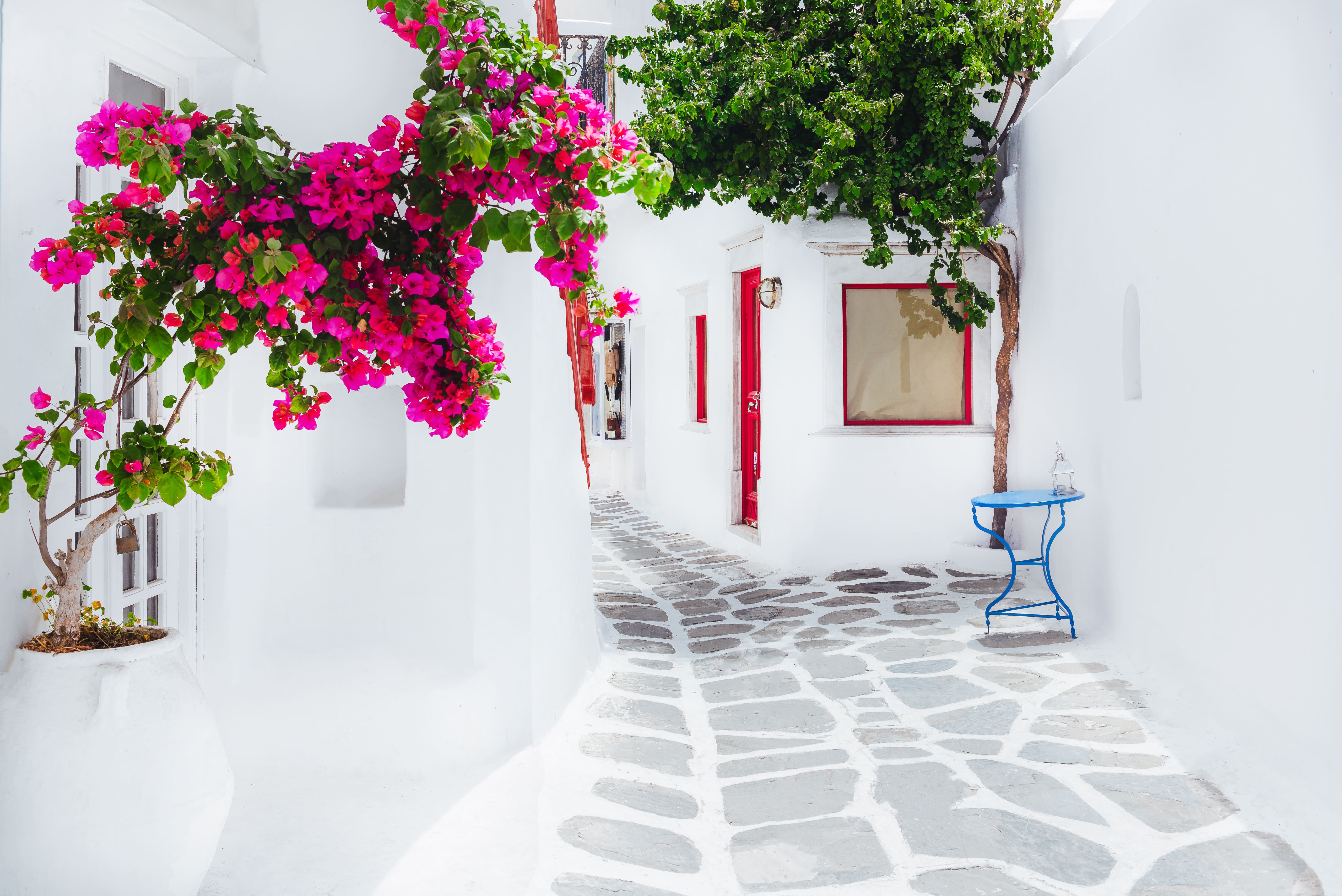 Traditional whitewashed house with blue accents overlooking the Aegean Sea in Mykonos, Greece