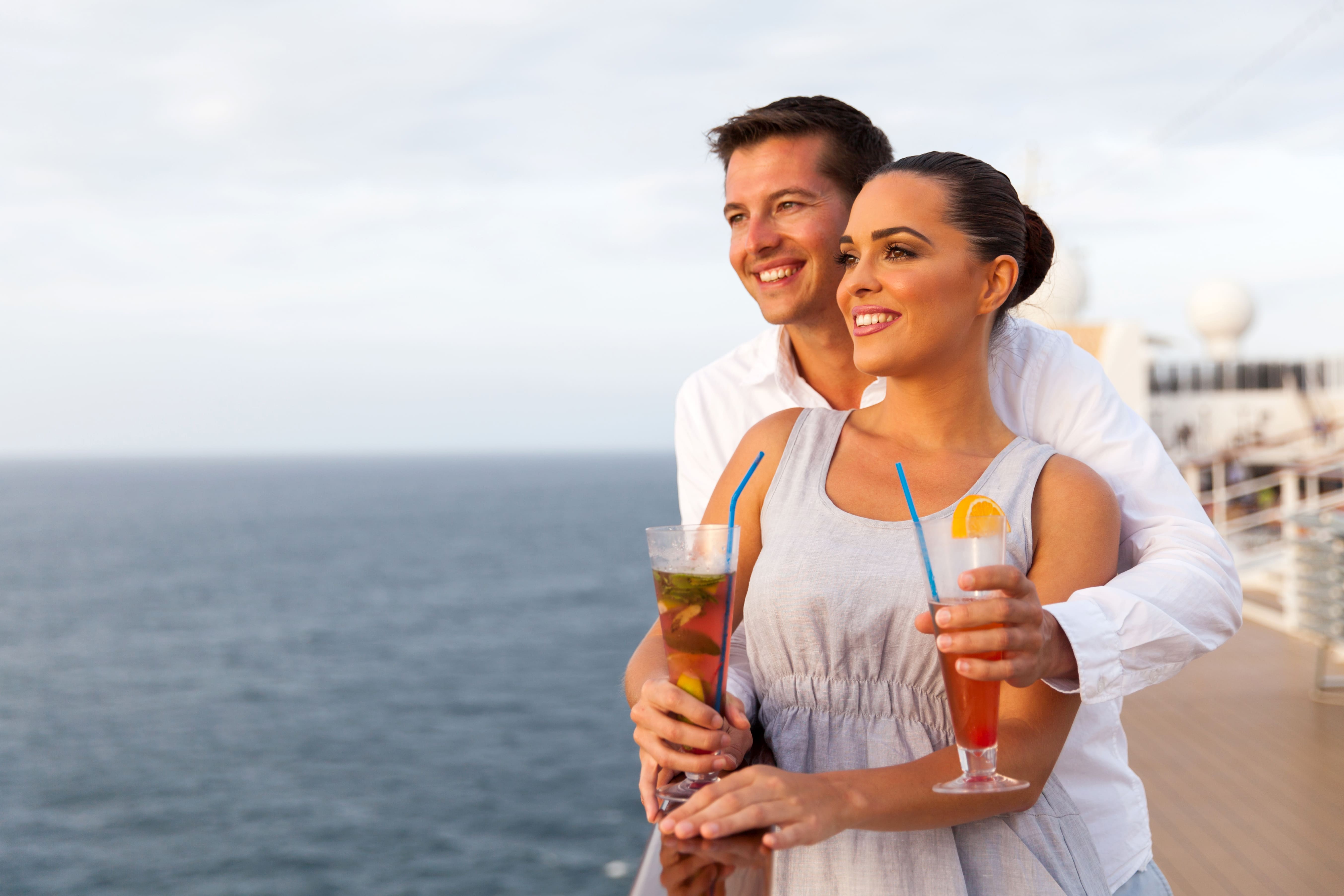 Young couple enjoying a romantic moment together on luxury cruise ship deck